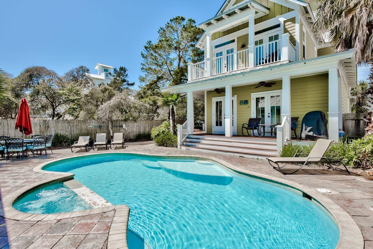 This lovely and well maintained home is located within one of the all time vacation prime areas in Destin, Florida, our Crystal Beach! Within a block from the walk over to the Gulf, you will enjoy the oasis of life of this property with a private swimming pool and separate guest house.  Entertaining family and guest in heated hot tub within swimming pool and large outdoor spaces, with generous rooms. This season is booking up fast, so you could purchase a potential income producing house at the beach, which has earned in past years up to $135,000.00 pre-Covid. Now 2021 brings forward people that are traveling again and the earnings will soar this summer.  This property will remind you of the quintessential beach house offered totally furnished and rental ready.