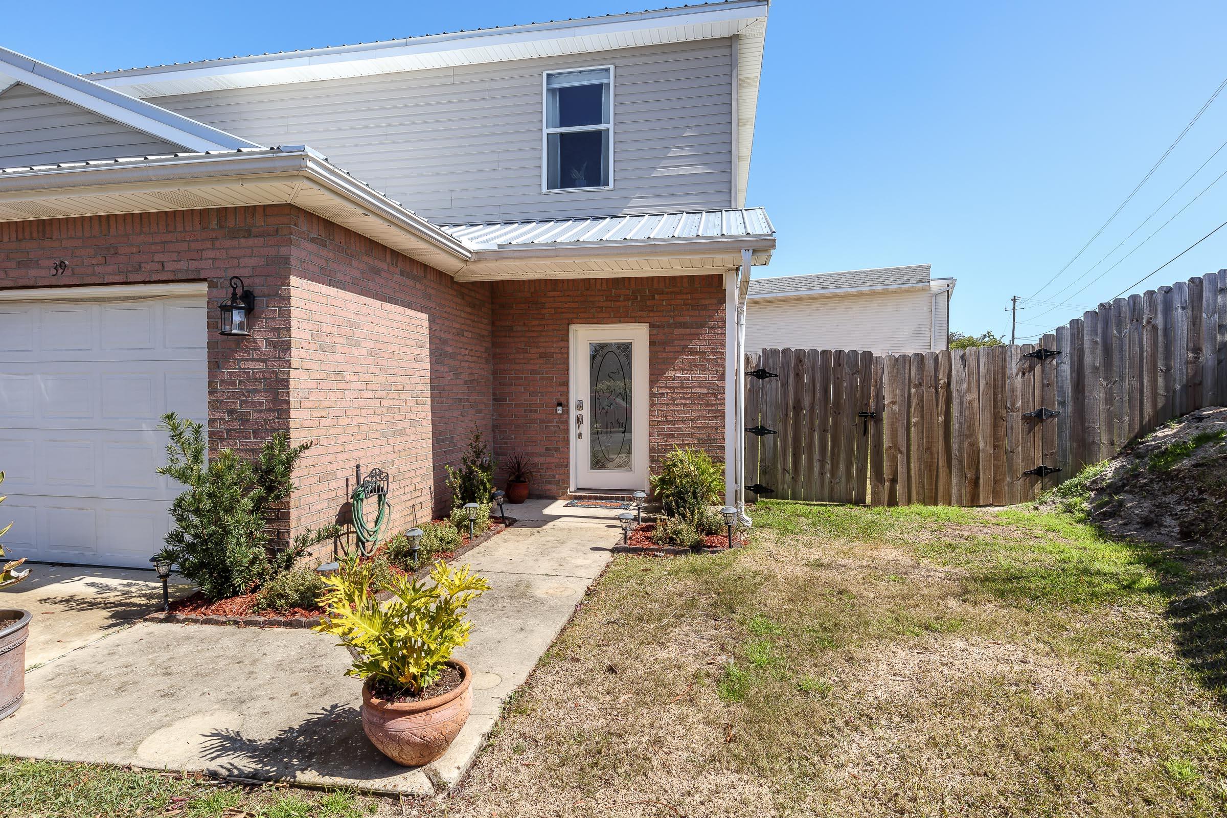 Updated townhome in the heart of Destin! Magnolia Park Townhomes is a quaint beautiful subdivision with excellent location. Make an appointment to see this updated unit today, where seller has replaced all carpet to LVP, has updated with fresh paint, updated appliances, and more. Boasting 1440 square feet and 3 bedrooms, 2.5 bath, this townhome has so much to offer. Unique to this end unit is also additional yard space on the end of the unit and it is ready to for you to utilize as you wish. HOA recently approved a bid for all exterior fencing to be replaced by the HOA by the end of March, so you will have new fencing to enjoy too! Close to the Emerald Coast Beaches, Destin Harbor restaurants and nightlife, and so much more!