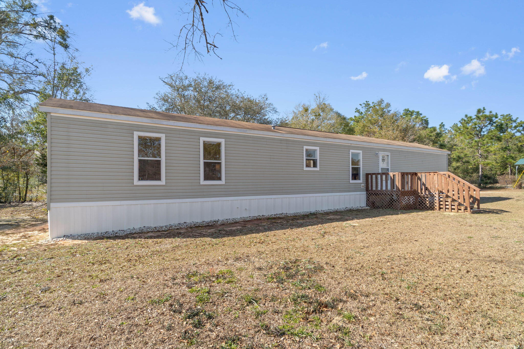 Beautiful 5.67-acre property on a paved road! 3BD/ 2BA home built in 2017 resides adjacent to the Black Water State Park. The homes interior is in phenomenal condition and has been well maintained. Privacy abounds! Shady trees and cleared land.The property features, a fully fenced property line to include a gate at the entrance, fenced sections or pastures perfect for livestock, or other agricultural desires. Water spickets are located at several points on the farm. Additionally, the property includes a shed/workshop great for storage and/or future projects!20mi to Whiting Field, 31mi to Navarre Beach, 41 mi to Hurlburt AFB