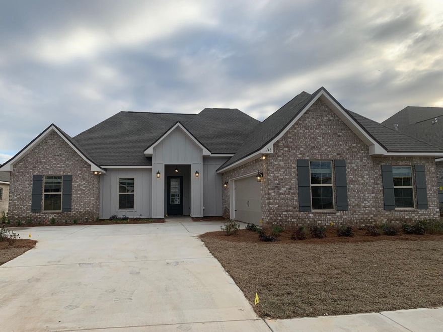 The CEZANNE IV G in The Trails at Hammock Bay community offers a 4 bedroom, 2 full bathroom, open and split design with a computer nook. Upgrades added (list attached).  Special Features: double vanity, garden tub, separate custom tiled shower with frameless door, and walk-in closet in master bath, kitchen island, walk-in pantry, boot bench in mud room, covered patio, recessed lighting, undermount sinks, bronze plumbing fixtures, framed mirrors, smoke/carbon monoxide detectors, landscaping, architectural 30-year shingles, flood lights, and more!Energy Efficient Features: tankless gas water heater, kitchen appliance package with gas range, low E-MI windows, and more!