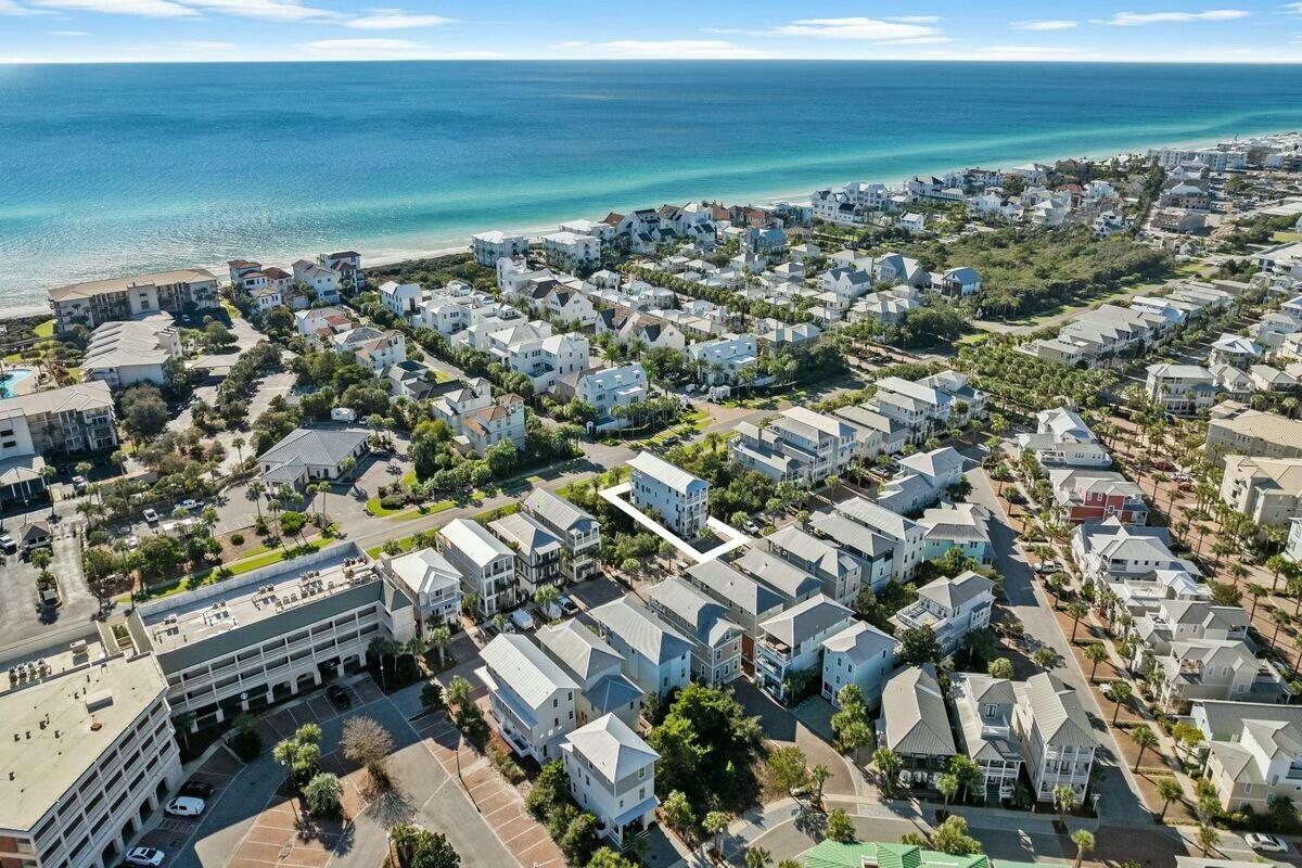 New price, ready for a buyer! Discover this newly built 2,589-square-foot luxury home along Scenic Highway 30A in the heart of Seacrest Beach. Boasting Gulf views, deeded beach access, and proximity to premier 30A destinations like Rosemary Beach and Alys Beach, this property offers the ultimate coastal living experience. Whether you're looking for a second home or a high-performing vacation rental investment, this home is designed to impress. Situated just steps from the vibrant shops and dining options of Seacrest Beach and the famous 12,000-square-foot lagoon-style community pool, this home is also just a short stroll or tram ride to the sugar-white sands of the Gulf. Deeded beach access and seasonal tram service make getting to the water a breeze. The home is within walking or biking distance neighboring hotspots like Rosemary Beach, Alys Beach, and 30Avenue, ensuring endless opportunities for dining, shopping, and entertainment.

Designed with comfort and style in mind, this 4-bedroom, 4-bathroom home features two primary suites, a convenient first-floor bedroom, and a fun second-floor bunk room, with custom queen over queen bunks, perfect for families and guests. The open-concept living and dining areas, anchored by a cozy fireplace, are ideal for entertaining, while the gourmet kitchen is a chef's dream. Outfitted with quartz countertops, stainless steel appliances, a gas oven, a professional-grade range hood, an ice maker, and two beverage coolers (one conveniently located in the third-floor wet bar), the kitchen also includes a pantry for added functionality.  

Outdoor living is elevated with over 1,000 square feet of porch space, including a sprawling 496-square-foot covered third-floor porch with Gulf views. This outdoor oasis features an outdoor kitchen with Naturekast cabinets and offers the perfect setting for relaxing or entertaining. The adjacent wet bar adds convenience, making it easy to enjoy refreshments while soaking in the coastal breeze.  

Every detail of this home has been carefully curated, from the designer tile and high-end fixtures in every bathroom to the hardwood floors, solid-core doors, and custom lighting throughout. Energy-efficient features such as three AC units and a tankless water heater ensure comfort and convenience year-round.  

Energy-efficient features like three AC units and a tankless hot water heater ensure year-round comfort, while a fireplace adds a cozy touch on cooler evenings. Whether you're relaxing in one of the primary suites or entertaining guests on the expansive third-floor porch, this Seacrest Beach home offers the ultimate blend of luxury, comfort, and coastal living.

Seacrest Beach's amenities include deeded beach access, seasonal tram service, a resort-style pool, scenic walking and biking trails, and 24-hour security, providing the ultimate coastal lifestyle. Offered fully furnished, this turn-key home is ready to be your perfect beach retreat or an exceptional rental property. Don't miss this opportunity to own in one of the most desirable locations on 30A!  

Home sold fully furnished and rental ready. Buyer to verify all dimensions and information.