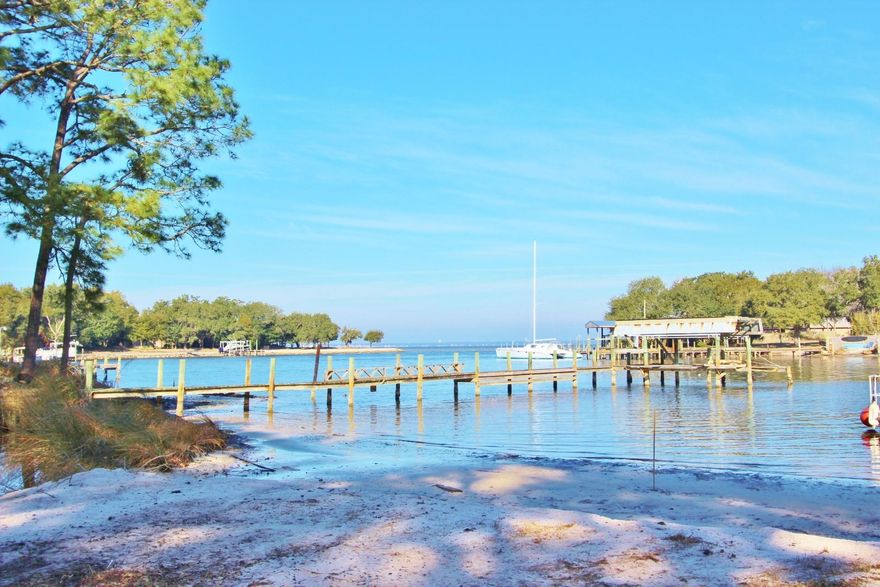 Price Reduced $50,000 in 2015! Bring all offers! BACK ON THE MARKET...Survey in hand, inspection repair items completed, Seller is READY TO CLOSE!!! Bring your boat and start enjoying waterfront living in Destin...all the rest has been thoughtfully taken care of for you. Only moments by boat to the stunning waters of the East Pass, Gulf and the Bay. This recently renovated home sits on a lot and a half with 117 feet of natural shoreline (including your own private beach!) on protected Marler Bayou; complete with dock. Don't let the age of this home fool you as it has just undergone a complete renovation to include: fresh paint inside and out, new hand scraped hardwoods throughout all living areas giving the home a feeling of warmth; a newly open kitchen with breakfast bar that boasts