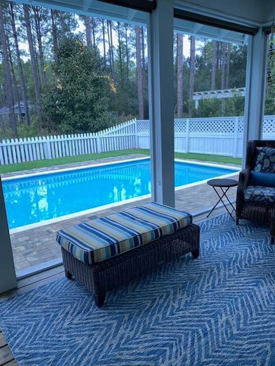 This is a warm & welcoming house that is looking for a buyer that appreciates a house that is designed to be a fun, peaceful and comfortable place to call HOME. You will love living here. This one level open floor plan is located on a large corner lot that backs up to a community greenspace The oversized 2 car side entry attached garage has a utility sink, a refrigerator and plenty of room for storage.  This 3 bedroom, 3 bath home features hardwood flooring throughout with travertine in the baths/laundry room. The kitchen has quartz countertops, custom cabinets, kitchen island, stainless steel appliances (including a new BOSCH dual/fuel 5 burner range) and add'l kitchen space with built-in wine fridge and trash compactor. However, your favorite feature might just be the large walk-in pantry. You will also appreciate the laundry room that comes equipped with Whirlpool Energy Star front loading washer and dryer. The living room is cozy with a gas fireplace that anchors the great room. You may spend most of your time on the screened-in porch (19X11) overlooking the large heated in-ground pool (30X14). The outdoor experience gets even better with brick pavers that surround the pool, an outdoor eating area and a fire pit. There is custom installed artificial turf that looks beautiful next to the private fence enclosing the outdoor area. Watersound Origins has many amenities including the Davis Love III 10 hole par 3 executive golf course which offers free golf to the homeowners. In addition, enjoy the fishing dock and kayaks on Lake Powell, tennis, pickleball, fitness center, volleyball, community swimming pool and a soon to be completed full service town center.