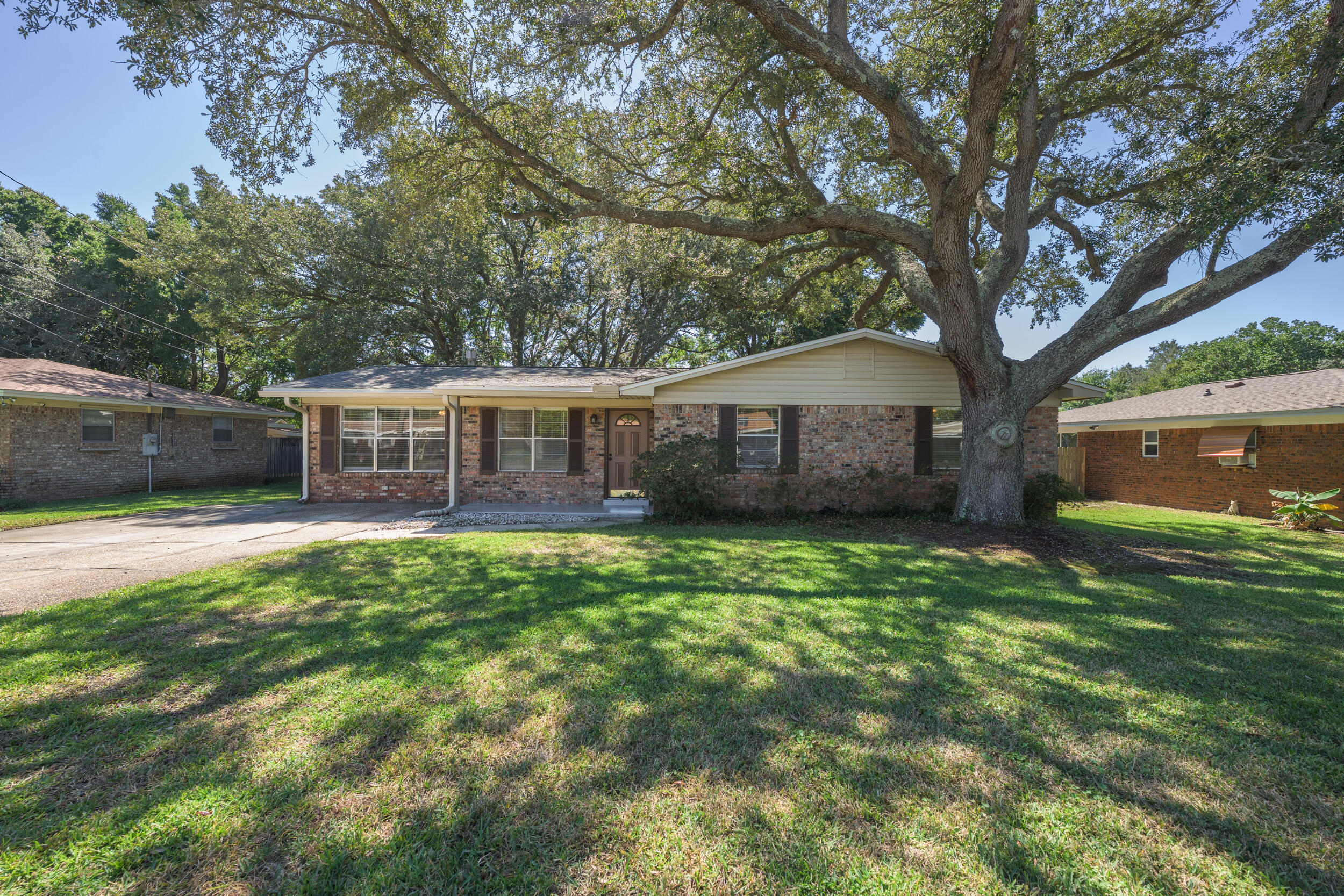 Searching for a charming, well maintained ranch style home with no HOA? Centrally located, this home is situated near shopping, dinning, downtown and beautiful beaches-this is the ONE! Upon entering the home, you will be warmly greeted by the newly painted, large living area with fireplace flanked by built-in book shelves. In the kitchen you will find a brand new range, dishwasher and garbage disposal-2025! The roof was replaced in 2022, water heater in 2019, HVAC in 2023. The covered back porch will provide the perfect space for holiday get togethers with friends and family. Fort Walton Beach HS is .7 mi and to Hurlburt Field it is 4.8 mi. Make your appointment. You do not want to miss this ONE!