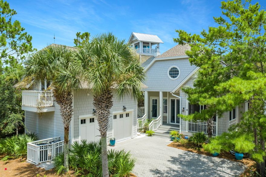 A beach lover's delight, this classic Nantucket style Watersound Beach home is located in the highly desirable Bridges area of the community, steps away from protected sand dunes, unspoiled beaches, meandering boardwalks, and a community pool overlooking Camp Creek Lake. Natural light fills the home with its vaulted living room, open to the large kitchen and dining area. The double-sided fireplace is a focal point of the living space and opens to a separate office/media room, offering a great space for entertainment, relaxation or working from home. The bedrooms are ideally located with a downstairs owner's suite with screen porch, two second floor guest suites with a shared lounge and a well-appointed carriage house that sleeps four.