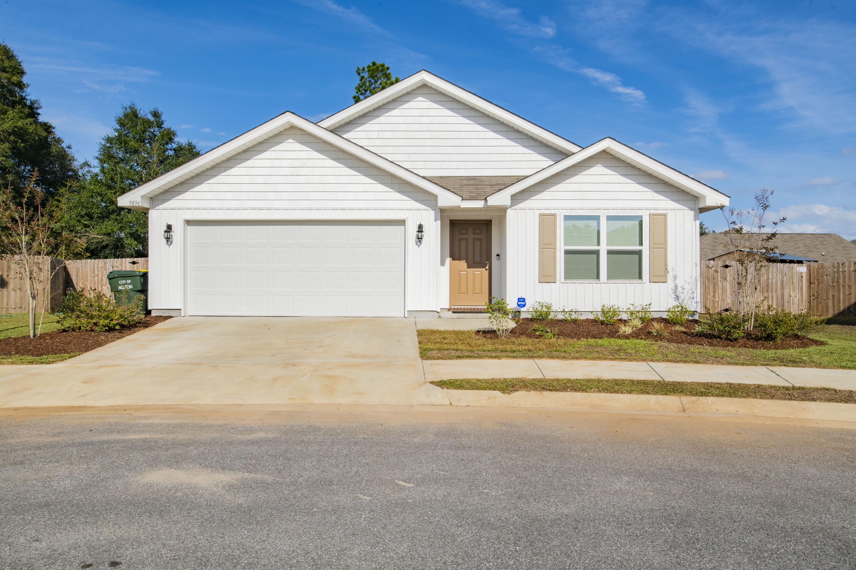 This 4 bedroom 2 bathroom home is located on a quiet cul-de-sac. The main living area has vinyl plank flooring and carpet in all bedrooms. Upon entering, You'll note the spacious entryway and 2 bedrooms and additional bathroom near the front of the house. The third bedroom is located midway, just off the laundry room. With the open concept living area, you'll enjoy the flow from the kitchen into the dining and living space. The kitchen has a breakfast bar and walk-in pantry. The master suite, just off the living room, has a walk-in closet, double vanity, large garden tub and separate shower. The fully fenced back yard has a covered patio, fire pit and ample backyard space to accommodate all your needs. Other notables are hurricane coverings, blinds throughout the house and 2 car garage. Ch