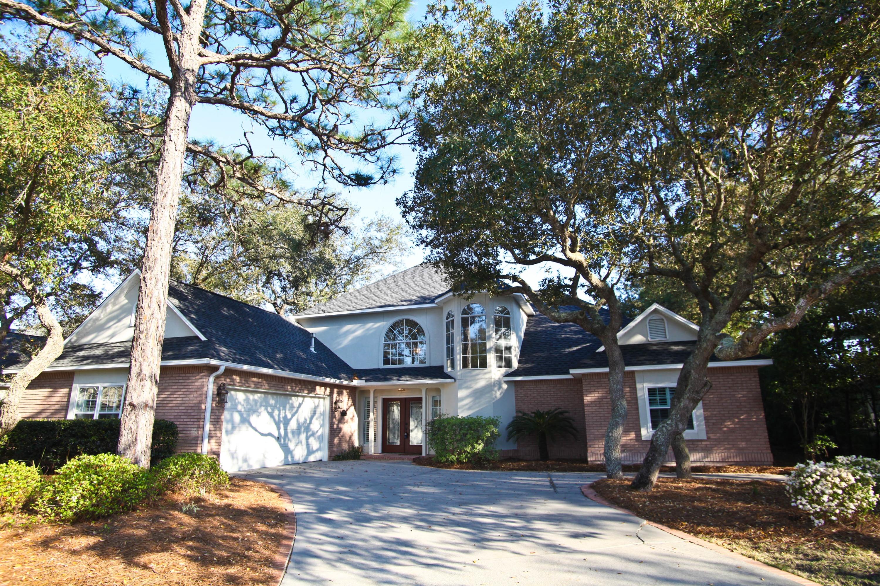 Don't miss this recently remodeled home with gorgeous upgrades. Breathtaking view of screened pool and waterfront.Home is a showplace featuring hardwood flooring in living areas and Trevertine tile in the baths and kitchen. Dream kitchen has new cabinets, exquisite granite counter tops, stone backsplash, stainless steel appliances with built in microwave and over. Don't miss the pantry door and interior shelving in pantry that matches cabinets. Master bath has double vanities with new cabinets with new granite counter tops but the best feature of all is the newly tiled shower with tile extended to surround the whirlpool tub.