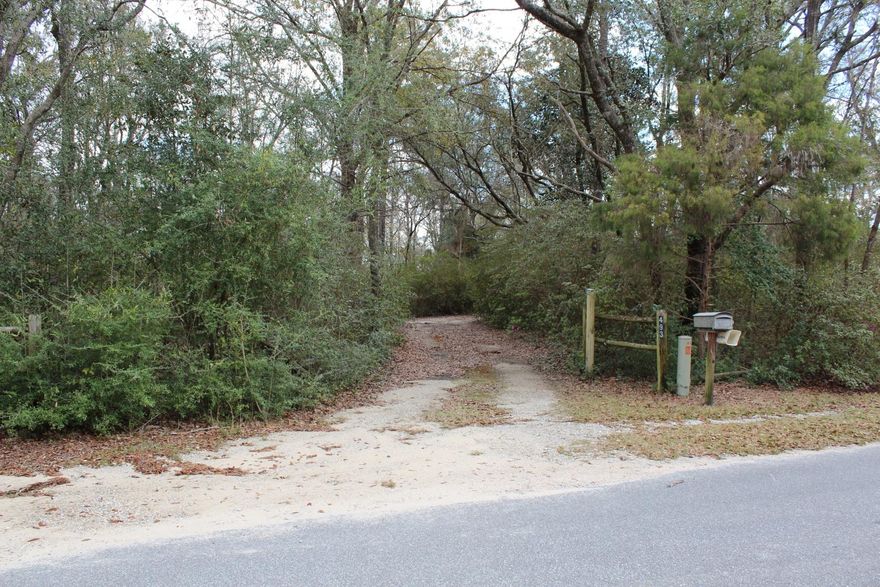 Well maintained home with large trees all over. Lake front is 91 ft., a dock is already in place. The carport has a 1/2 bath and large storage space in place. The carport is completely screened for those summer cookouts. Submit all offers on AS-IS contract also attached proof of funds or pre approval letter. Buyer will need to verify all measurements.