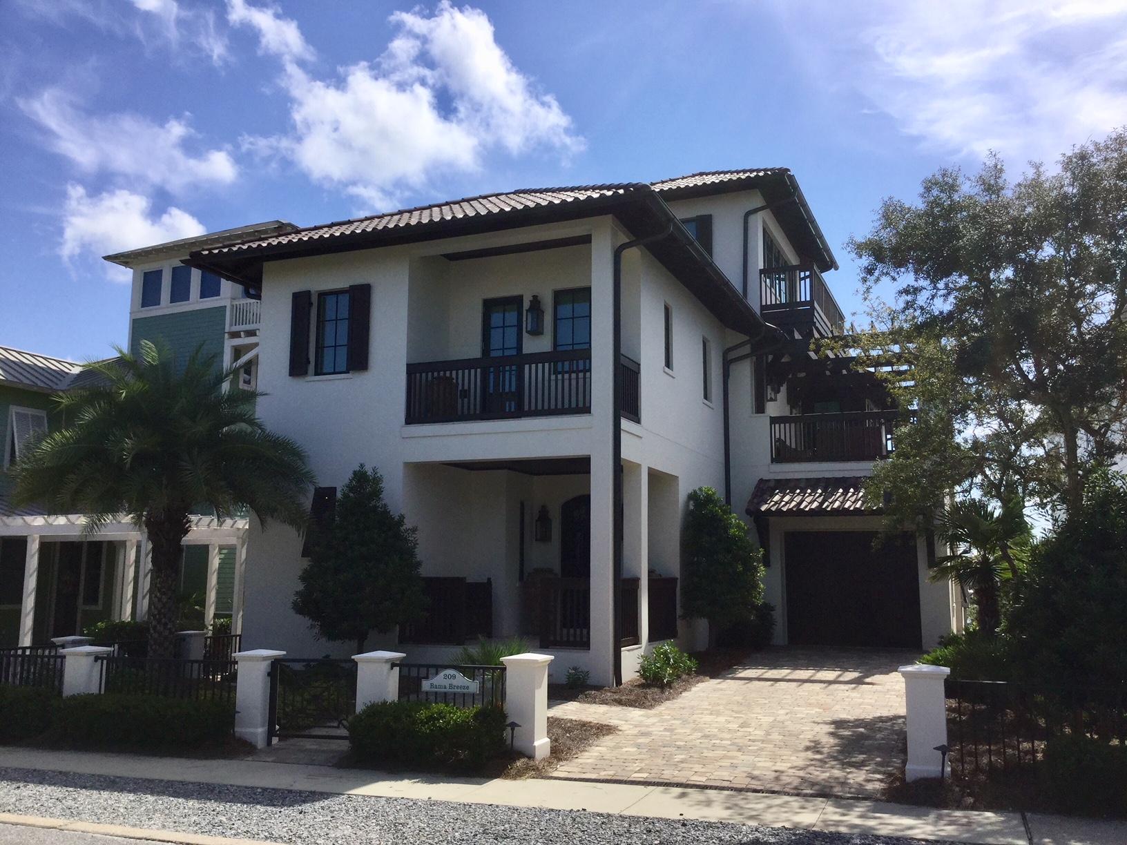 This extraordinary custom home in the gated community of Carillon Beach is located on beautiful Lake Carillon and enjoys Gulf of Mexico views from the tower on the third floor. There are too many custom features in this home to even mention from the wide plank white washed floors to the lighted quartzite countertops in every bathroom and kitchen to the handmade shell chandeliers to the gas lanterns, it is simply amazing. There are 4 bedrooms, 4-1/2 baths, an elevator, summer kitchen, outdoor alfresco dining area, garage, lakefront private beach area, bonus sitting areas in the master bedroom and on the second floor. Also on one of the second floor porches, there is an outdoor gas fireplace. The construction is solid concrete block and the roof is clay. EASY SHOW.