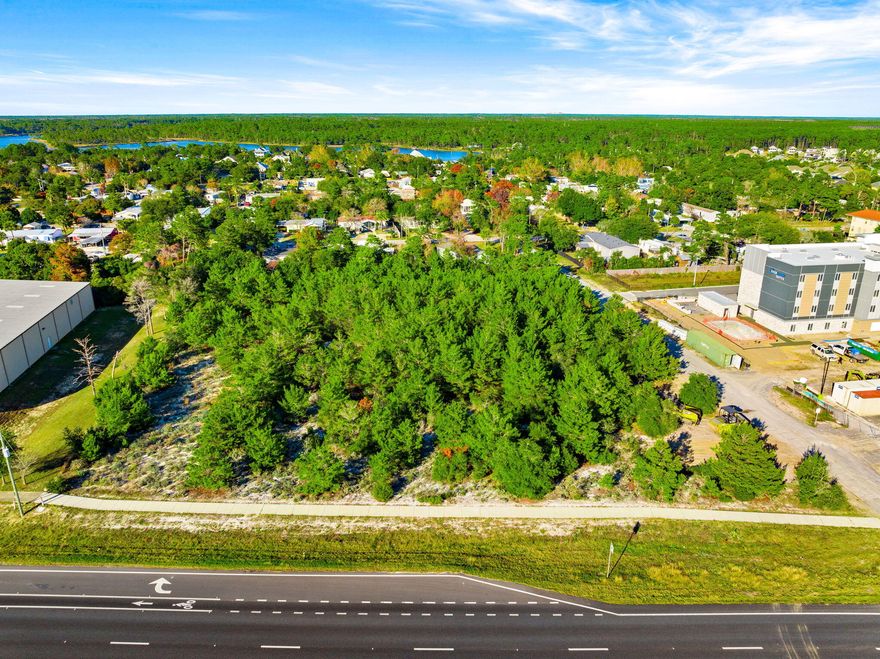 This 2.02‑acre parcel sits on the rapidly growing west end of Panama City Beach, offering exceptional visibility and a daily traffic count of roughly 30,000 vehicles. With a convenient median cut providing full access, the site is perfectly positioned for high‑impact commercial development. Nearby landmarks include the gated golf community of Wild Heron, Publix, and Phillips Inlet leading to scenic Highway 30A. The area continues to expand with new residential and retail growth, including the recently completed Vintage at Lake Powell community featuring approximately 20,000 square feet of vibrant restaurant and specialty retail space. This location places the property at the center of one of the most promising corridors in the market.
