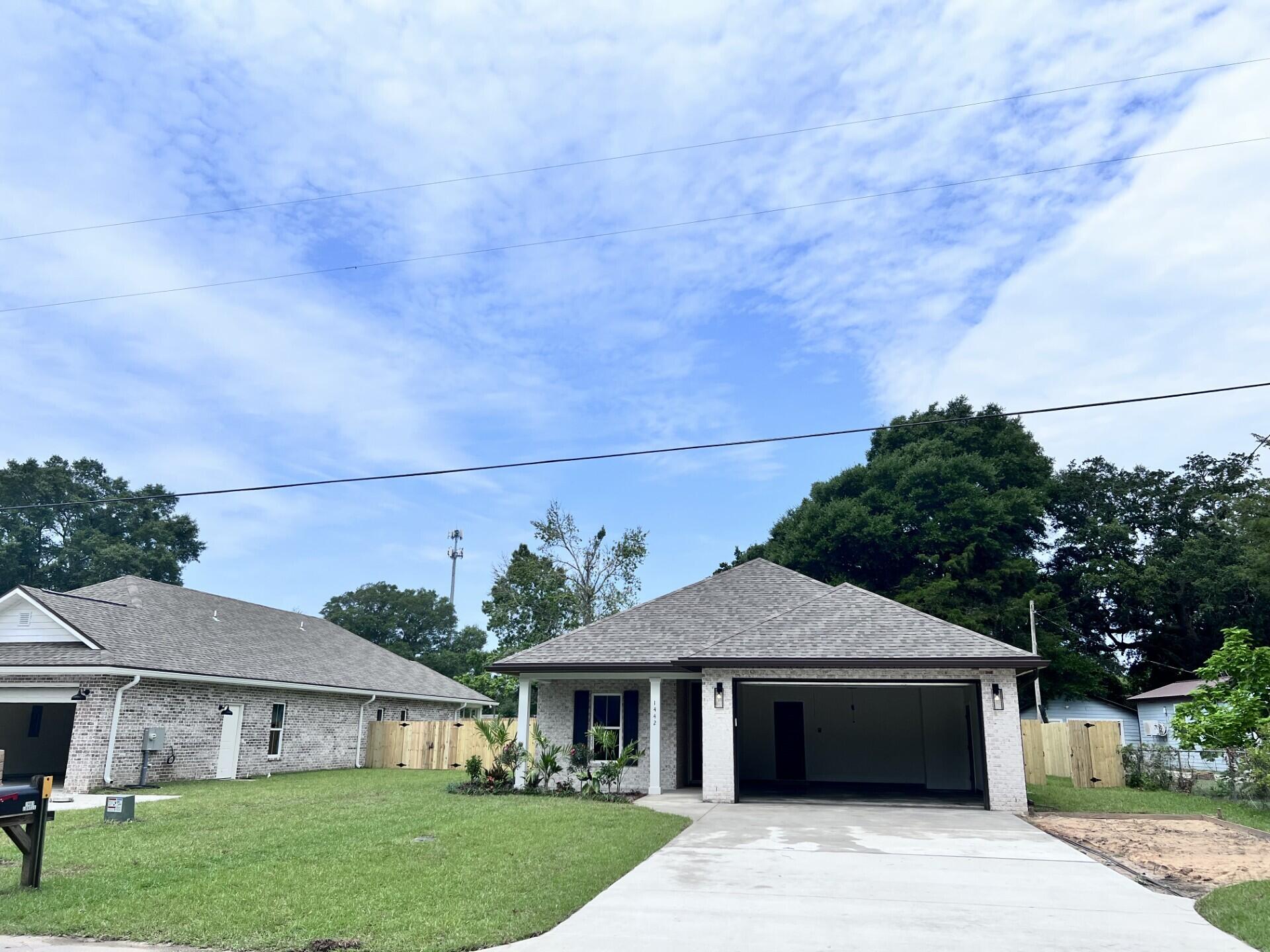 This Beautiful 4 bedroom, 3 bath home is located at the East end of Niceville. The seller pays 10,000 towards the buyer's closing cost, doc stamps on the deed, title insurance and all title related fees. This all brick home sits on .29 of an acre with no HOA fees. You'll absolutely LOVE this OPEN floor plan, featuring 9 ft. ceilings throughout, an oversized garage, extra parking pad, upgraded spray foam insulation in the roof for energy efficiency and many more amenities. The kitchen is divine, featuring white custom cabinets, soft close drawers, upgraded sink, gas stove, pantry, undermount lighting and quartz countertops throughout. Enjoy the upgraded lighting package with ceiling fans in all the rooms and a floor plug in the family room with a reverse trey ceiling with lighting. This custom plan provides you with everything you need in a home! Love entertaining, the kitchen and family room open up to a screened porch with an extra concrete pad for grilling and an extra patio set. The master bedroom has a trey ceiling with recess lighting and the master bath is wonderful for relaxing, taking a long bath, enjoying endless hot water with the gas tankless hot water heater and the deep soaker tub. The master shower, boast custom tile with a rainhead, 2 separate sprayers, bench for sitting while shaving and seamless glass. You will actually want to do the laundry, with a custom folding table with quartz countertop and custom designer hooks attached above. When you want to relax and rewind, the back yard is the place. You'll enjoy a fully sodded yard, full gutters, sprinkler system and a privacy fence, making up-keep easy. This home has everything and sits on a large lot. Perfect for a pool, and pets. Pictures shown mimic the exterior of the home when it's completed, but an extra parking pad will be poured.
This home is in walking distance to Bluewater Bay gym, restaurants, just minutes from A+ schools, Eglin Air Force Base, Special Forces, Emerald Coast beaches, shopping, hospitals and more.