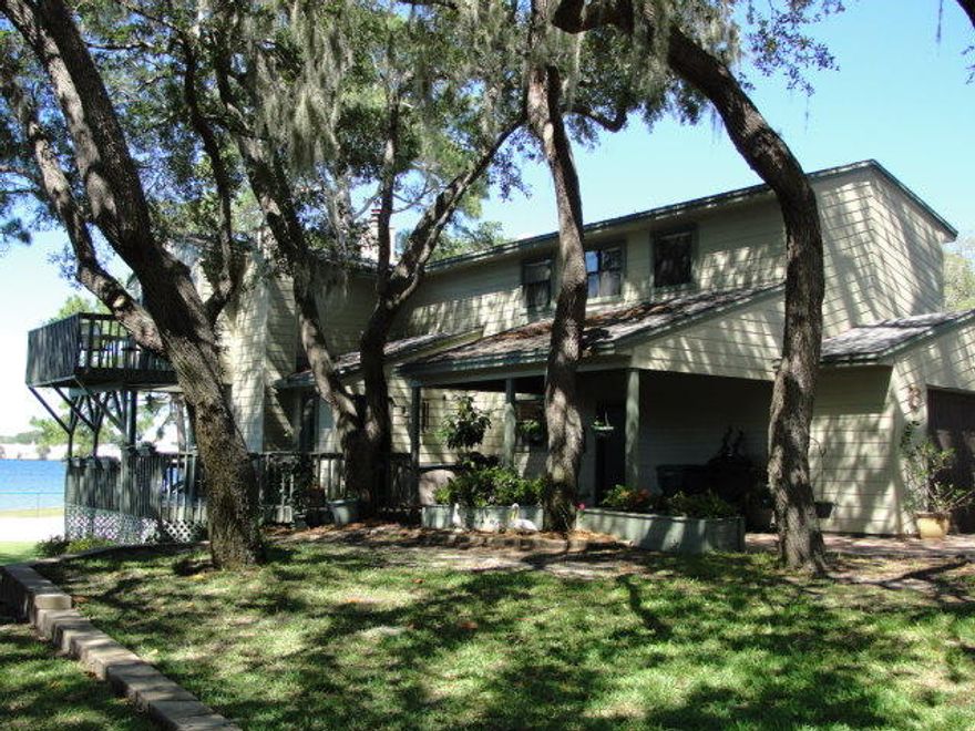 This is the rare find you've been looking for! Seldom does one of the premiere units in the development come on the market. But here it is! The end unit directly facing beautiful Kidd Bayou, with views of Cinco Bayou, too! Kidd Bayou Oaks is nestled among the oak trees with over 350 front feet along the shoreline. Enjoy the quiet cove setting with protected waterfront. This home has so much to offer: 3 bedrooms, 2 & 1/2 baths with an open living area providing water views in multiple directions. Enjoy your spacious covered porch off the living room or the private bedroom porch perched above the water in the treetops. This is a wonderful unit ready for your decorator touches. Water views from almost every room.HOA controls dock and slips - slip fee is $10/month, when slip available.