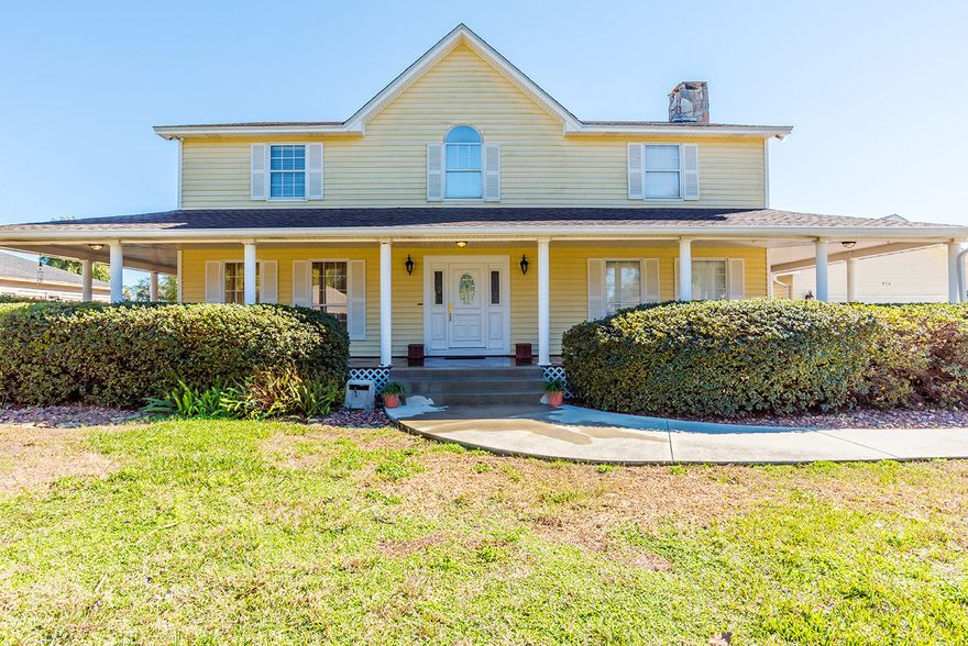 This spacious 2 story beautiful home is located in the convenient neighborhood of Villa Venyce on a deep water canal. With great curb appeal, separate garage and a grand wrap around porch, you've got to see this beauty for yourself! It has 5 bedrooms and 3 bathrooms and home features 2 separate living spaces, one which is a sun room encompassed with windows. The second living space has a wood burning fireplace with a charming brick accent wall. The kitchen boasts of beautiful granite counter tops, refinished solid wood cabinets, stainless steel appliances, large walk in pantry and separate formal dining room. The master suite is enormous with a full sun room/bonus room that also has a kitchenette. This space would make a great gym/yoga room or office. It also features 2 walk in closets and