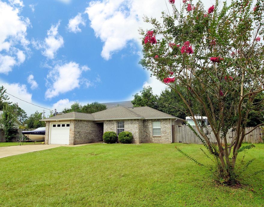 Gorgeous Brick home with 3 bedroom, 2 baths  located South of I10 in Crestview.   This home iis extremely well maintained.. in 2018 a large workshop/shed was installed in the backyard ($6500), 2018 repaired the privacy fence and deck, replaced the HVAC.  Master shower was just gutted to the stud and durock, porcelain tile with custom accents were installed.  Bathrooms have been updated with light fixtures, and all new vinyl plank flooring in kitchen, family room and hallway.  There is a large concrete pad on the left side of the home perfect for boat parking! Enter the home and notice the vaulted ceilings! This is an open floor plan with the kitchen opening to the eat-in area and living room! The kitchen features a refrigerator (2018), built-in microwave, stove/oven and dishwasher! Cabinet