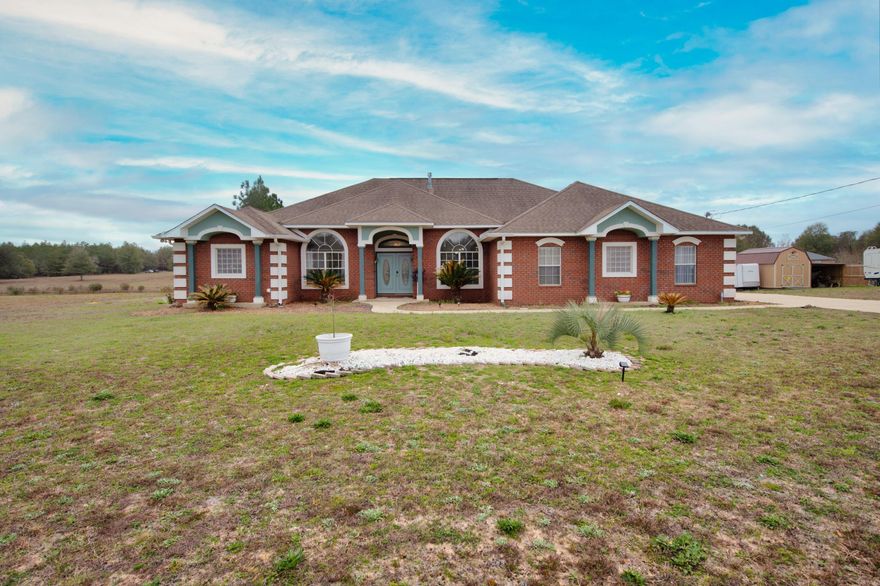 Welcome to your lakefront paradise! This stunning brick home boasts a luxurious salt water pool and sits on almost an acre of beautifully landscaped land, offering breathtaking views of two serene lakes. The peaceful surroundings are perfect for those seeking a tranquil retreat from the hustle and bustle of daily life.Upon entering the home through the gorgeous mahogany French doors with leaded glass, you'll be immediately greeted by the warm and inviting cherry hardwood flooring that runs throughout some of the main living areas. The spacious living room features bullnose corners, crown molding, as well as a cozy gas fireplace for those chilly evenings.The chef's kitchen is spacious enough for the chef to spread out and features custom solid wood cabinets, stunning granite countertops and a double wall oven. This kitchen is perfect for entertaining and preparing gourmet meals and has full view of the family room so you don't even have to miss out on the action.

The home offers two master suites on opposite ends of the home, each with its own private bathroom, providing a perfect retreat for you and your guests.

Step outside onto the screened-in lanai, where you can relax and take in the breathtaking views of the lakes. The lanai is completely screened in to ensure a bug free experience and overlooks the pool, and pair the views with the soft sounds of the dolphin water fountain to be engulfed in the ambiance of this incredible outdoor living space. Take a dip in the salt water pool during the day or turn on the pool lights for a midnight swim. Hang out by the firepit by the lake or stroll down to the dock, where you can fish, kayak or simply take in the beauty of the surroundings. 

This home is truly a must-see for those seeking a luxurious, peaceful retreat with all the features and amenities of a dream home. Come and experience the lifestyle you deserve in this stunning lakefront property.
