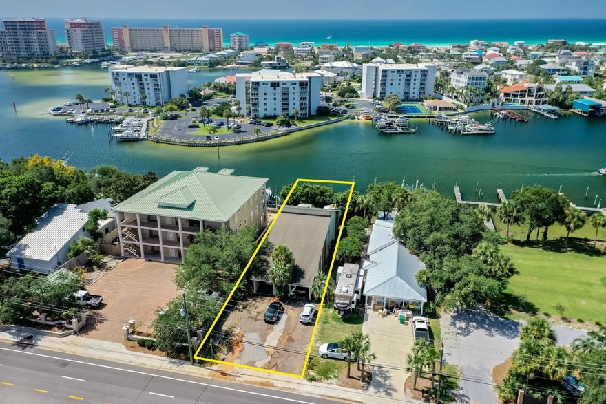 PRICE DRASTICALLY REDUCED BY $100,000! Duplex perched upon one of the highest elevations along the scenic Harbor of Destin, Florida!  Includes two deep-water boat slips! Each unit has 2 bedrooms and 2 bathrooms and a patio/deck facing the harbor with potential view of the Gulf of Mexico. There are two covered carports with an abundance of guest parking along the drive! Both units are currently occupied by tenants, both of which involve leases that expire on March, 2021. This is an increasingly rare opportunity to own on the coveted harbor along the Emerald Coast!