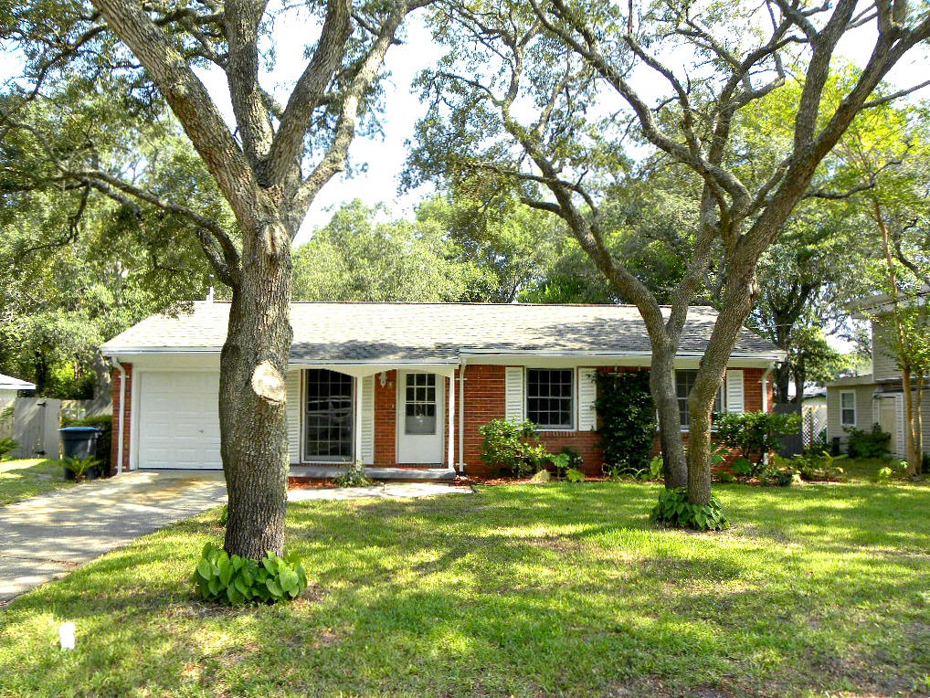 WOW CUTE CUTE CUTE! From the minute you drive up to the moment you step inside you will be pleasantly surprised. Living room has soft interior paint color, window from floor to ceiling, oversize baseboards, designer ceiling fan and plank style laminate flooring throughout. Dining area is open to the living area great for entertaining. Kitchen has been totally renovated with new cabinets, granite like counter tops, upgraded stainless/black appliances to include a designer vent hood and French doors lead out to the open patio. Master bedroom has two closets one has mirrored doors and the other is a walk-in. Full bath has a new vanity, new mirror, lighting and oversized shower. Two additional bedrooms with new designer carpet. Don't miss the half bath off the garage. Beautiful