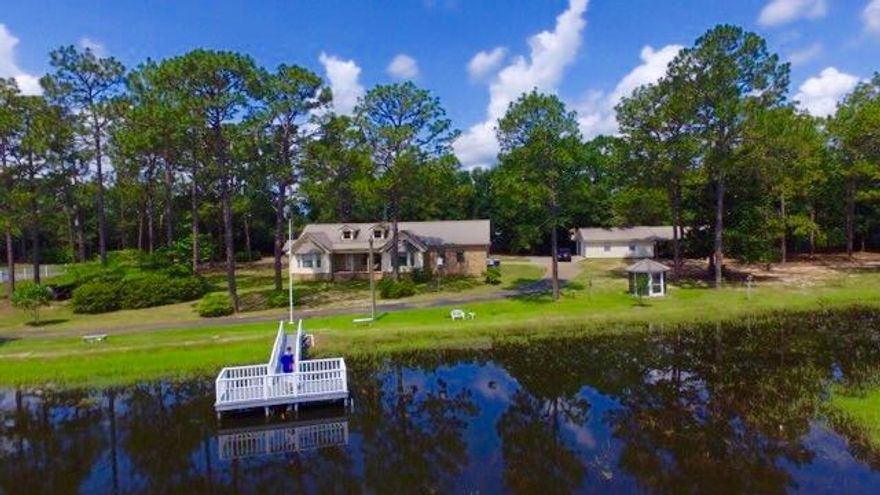 10 ACRE ESTATE WITH A THREE ACRE LAKE!This 10 acre property has it all. The main home is an all brick exterior, metal roof, 3 bedrooms plus an office, 3.5 baths, Fireplace, 32 by 11 Carport, 700 sq ft Mother in law quarters with a full bathroom and kitchen, 10 by 13 Hot tub Room, Detached 2 Car Garage, Shed, Whole House Generator, Sprinkler System.