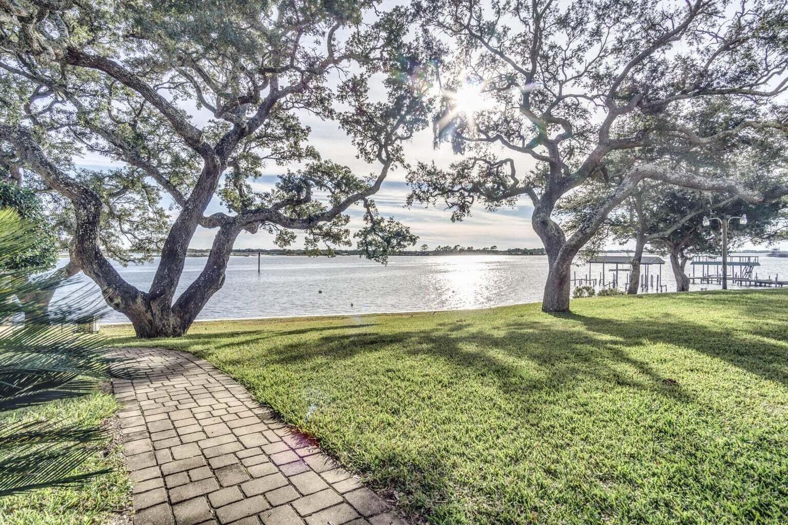 Enjoy your little piece of paradise at The Ceder's! Waterfront Florida living at a great price! You'll have access to a beautiful pool, private beach, boat dock, BBQ grills, kayak racks and a serene courtyard all situated in a wonderful location just minutes from the bases, and the beautiful beaches of the Gulf of America and shopping. This is a great opportunity to call home OR your home away from home. Fully furnished and allows STR.