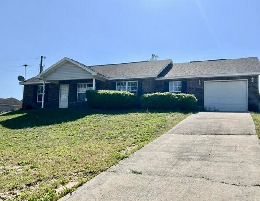 Potential abounds with this larger 4-bedroom, 2-bath REO home. Built in 2006, this home offers 1,598 square feet of comfortable living space on a 0.29-acre corner lot. Home has classic brick front exterior, vinyl siding, and a 1-car attached garage. Inside the home you will find split bedroom design, indoor laundry, and a functional galley kitchen. Flooring is a mix of tile, laminate, and carpet. Home needs some minor repairs, which are mostly cosmetic updates, providing a fantastic opportunity to personalize and add value. Whether you're a first-time buyer, investor, or someone looking for a home with potential, this property is full of possibilities. Offers can be made on this property at https://mynextbid.com/property/2361/5151-Eagle-Way-Crestview-FL-32539 -  Fees may apply.