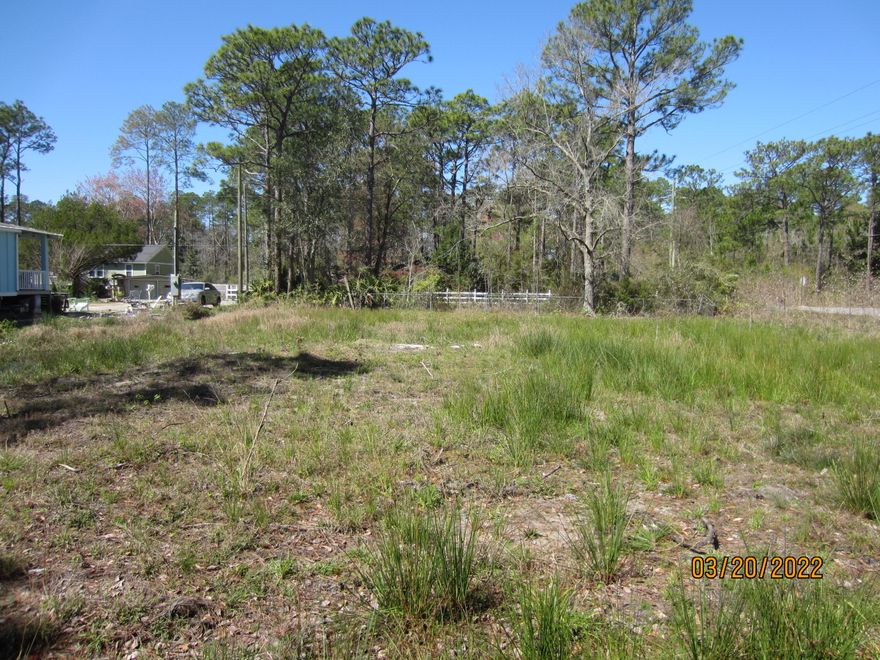 This is a corner lot that is 50 feet wide and 125 feet deep.   Public water and sewer are available to the property.  Paved road with culvert off East Ann Street.  Property has been cleared.  This property is nicely elevated and ready for a residence.  Very close to Cessna Landing where you can launch a boat.