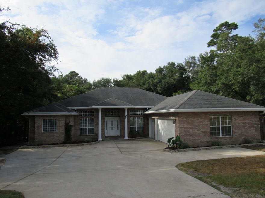 This fantastic 4 bed/3 bath house with a heated & cooled workshop/hobby room is located at the end of a quite tree lined street.  This house has a formal dining room & great room with a corner gas fireplace.  The kitchen has nearly new stainless steel appliances, tile backsplash, solid surface countertops & warm wood cabinets. The breakfast nook overlooks the very large fenced in backyard - plenty of space for a pool with yard left over.  There are 2 great storage rooms below the main house - one room the homeowner used as a workout room the other for storage.  Some great features of this home include new carpet, paint, oversized garage, whole house gas generator, & screened back porch.  Conveniently located to Eglin & Duke Field - just a short drive to the white sugar beaches of Destin.