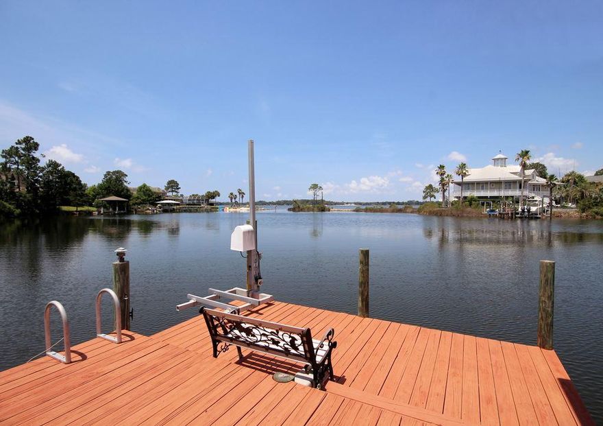 DEEP PROTECTED waterfront home in Dana Pointe with an attached guest apartment and screened in pool. This property with its amazing western sunset views is located on a Sunset Cove, a protected deep water lake with a channel leading out to Boggy Bayou. The custom built 1-story home will pamper you with over 4100sf of living space including 5 bedrooms and 4.5 baths as well as a 3-car garage. The seller has just spent over $50,000 updating all the baths, painting and replacing the screened enclosure! When you enter the home through the wide foyer, you are captivated by the view of the pool area and bayou through the triple sliding glass doors in the family room. An oversized dining room with built in display shelves is to your left and an office with a built in desk is to your right.