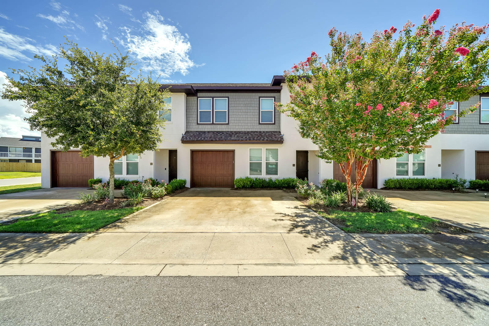 Centrally located in West Destin and move-in ready! Coming into this home you will immediately love the space and feel at home by the fresh, tranquil color scheme and high-end finishes. Enjoy granite counter tops and all wood cabinetry throughout the kitchen and bathrooms. The kitchen also includes stainless steel appliances for a cohesive feel. Downstairs is a beautiful open living floor-plan with wood-look flooring and a private patio. Upstairs you will find 3 spacious bedrooms all with walk-in closets. For hurricane season enjoy the high impact doors and windows, ready for every storm. For the icing on the cake, enjoy the neighborhood pool and clubhouse. For easy maintenance, the HOA maintains the front landscaping, trash, street lights, and all common areas.