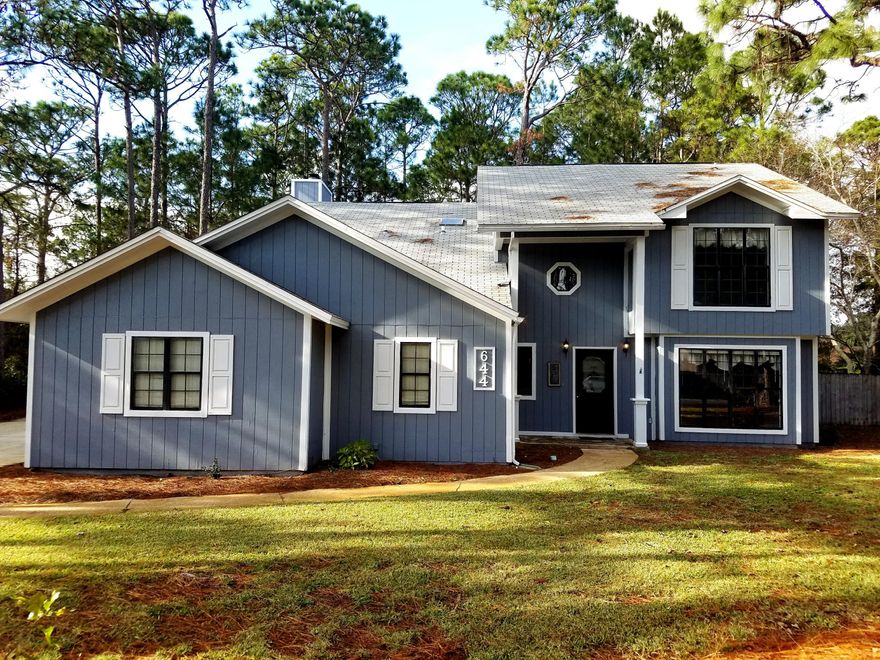 Fantastic location in Bluewater Bay Resort Community! It has ALL NEW interior/exterior PAINT and ALL NEW CARPET!! This amazing split bedroom plan home is complete with three living areas..in addition to the main living room, the den has a WOOD BURNING FIREPLACE and could be an office overlooking the PRIVATE BACKYARD and a huge loft upstairs. The kitchen has ample oak cabinets and lots of CORIAN COUNTER space for the busy cook. There's even a built in mini-bar and BREAKFAST BAR. This home is on a big corner lot with AMPLE PARKING. There's also fenced area suitable for pets or young children. HVAC & WATER HEATER ONLY 3 YEARS OLD. Buyer to verify specifications and dimensions. NO HOA!