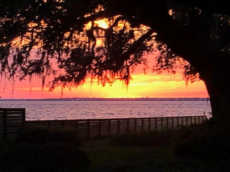 Gorgeous Waterfront Home perched amongst Native Oak Trees with Spanish Moss. Beautiful Sunsets year round. This timeless contemporary architectural design has a 2020 New Roof, Newly Painted, New Rear Synthetic Wood Deck to enjoy your view of Amazing Sunsets thru the Oaks.  This house has a beautiful Cathedral Ceiling Living Area with Brick Fireplace and tongue and groove wooden trimmed ceiling. Fresh and Inviting Kitchen with Stainless Steel Appliances and Quartz Countertops through out.   Dining Room to enjoy dinners with Guests or Family. Large Master Bedroom with views of Choctawhatchee Bay. 4th Bedroom has ensuite Full Bathroom and can be Bedroom or Home Office.  Laundry Room leads out to Double Car Garage. Rear patio is perfect  for relaxing after a long day.