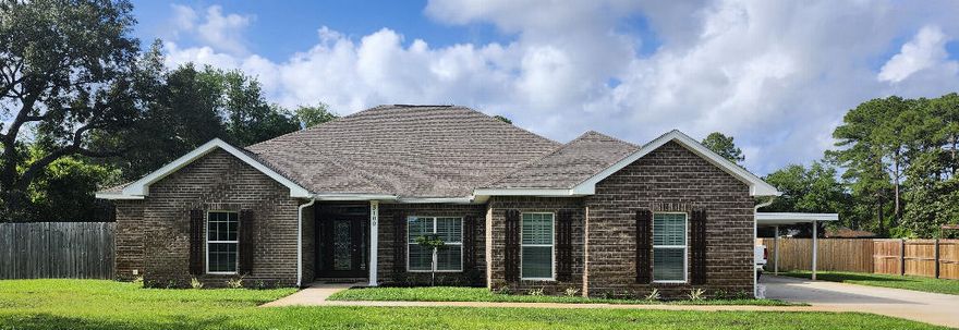 This 4/2.5, 2500 SF all-brick home built in 2019 offers energy efficient 2 x 6 exterior walls, 9-foot Spanish lace ceilings, tray ceilings, crown molding, solid wood doors. It has custom cabinets, granite countertops and plantation shutters throughout.Open-concept design, large main living area, full dining room, spacious kitchen with custom cabinets and beautiful granite countertops, breakfast nook, large bar overlooking the family room, and stainless-steel appliances (which may convey). The cabinets include a Butler's Pantry with smoked-glass doors.The master suite located opposite the additional bedrooms offers a private retreat with a large en-suite bath. The large master bathroom offers a double granite vanity, walk-in shower, six-foot whirlpool tub, and walk-in closet. Three additional bedrooms (single, and Jack & Jill) provide plenty of space for family and guests. Also, with a dedicated home office, you'll have the perfect space for remote work or study.
The large two-car garage enters into the pantry/kitchen area. Offers a carport a large storage building for lawn equipment and other items. 
The second driveway takes you to the 1500 square foot insulated shop with a separate heated and cooled one bedroom apartment/office inside. It has three 10 x 10 roll-up doors, and is built to Miami Dade Hurricane specifications. There is also a privacy fence around the entire property.
This home is zoned for Gulf Breeze's top A-rated schools, and nearby shopping and restaurants. NO HOA. Home Warranty.

This property can be subdivided into 3 lots.