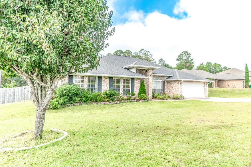 This built to last home has four spacious bedrooms and three full size bathrooms. Situated on the south side end of the number one fastest growing city in Northwest Florida, (The City of Crestview). You are only minutes away from Eglin Air Force Base, Duke Field and the sugary white sand beaches along the Emerald Coast! This home has fresh clean carpets in all four bedrooms and stylish custom tiled floors throughout the rest of the home. The master bedroom is a spacious 23x14 with an ensuite bathroom and walk in closets. Master bath includes a jetted tub, a separate shower and his and her vanities. Kitchen has appliances that are less than one year connected to a laundry room that leads outside to your open and woodsy backyard. Continued...