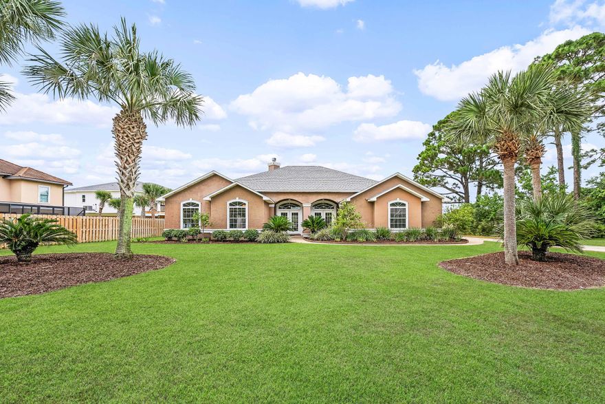 Nestled in the sought after golf course community of Tiger Point on the 6th hole, this 2800 square foot home offers a screen enclosed swimming pool with a new pool liner, NEW ROOF, New exterior HVAC unit, soaring 12 foot ceilings and abundant natural light. This home is ideal for entertaining with 5 access points to the gorgeous pool area, a wet bar and 2 separate living spaces. There are a plethora of custom features and upgrades in this home, such as lighted art niches, mosaic marble flooring details, under cabinet bathroom lighting, and custom built-in cabinets. The kitchen comes equipped with abundant cabinet storage, beautiful wood cabinetry, granite countertops, an island with breakfast bar, wall oven, bread warmer, electric downdraft range cooktop, a desk, and a walk-in pantry. The