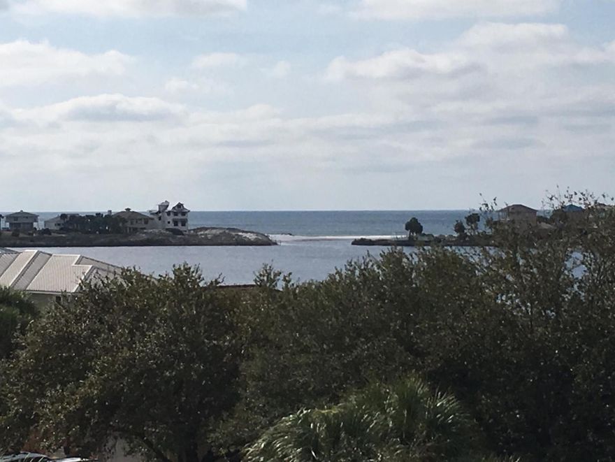 REO. Great location on 30-A! Luxurious 2 Story condominium. 2 bedroom 2 1/2 bath unit featuring luxurious finishes: viking appliances, travertine tile, 2 large decks that overlook Eastern Lake. No expense was spared in the construction of this building. Great opportunity for owner occupant or investor. Great views and access to Eastern Lake. This unit features some of the best views on Scenic 30-A!!