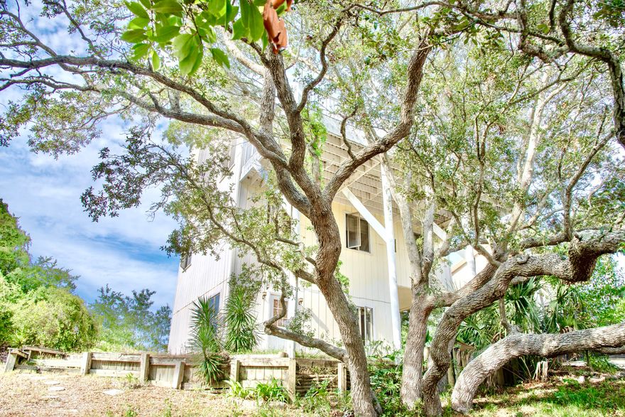 Calling all Investors! Rare Opportunity to own in this incredible neighborhood in the heart of Destin. This four bedroom, three story home offers endless potential. Do not miss this opportunity to own on the highest elevation in all of Destin. Enjoy panoramic views of the Gulf and the Bay from every angle of the this home. This home was meticulously designed to maximize the stunning views, featuring several expansive balconies on both sides of the home. This property makes for a perfect primary or secondary residence featuring an open dining/living concept on the third floor and three spacious bedrooms on the second floor. A separate apartment with a private entrance and balcony on the first level makes for a lucrative rental investment property. Additionally, there is a large
