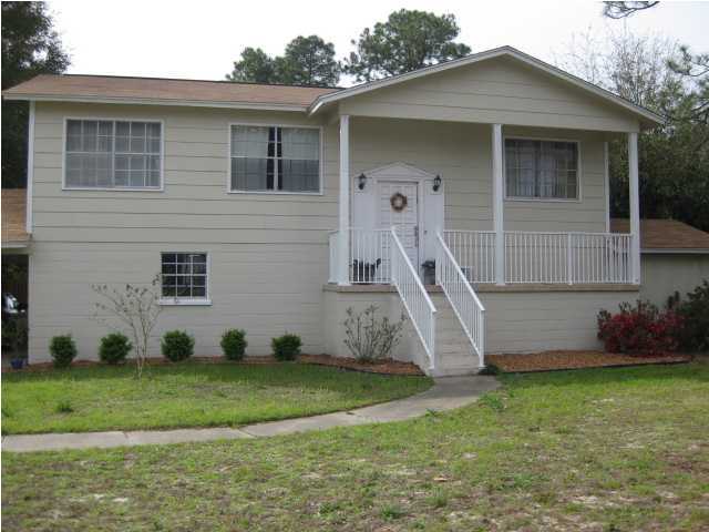 NOTICE*** If you have shown or seen this home before, you need to see it again! New carpet in the downstairs looks Fantastic!!! SPACE, SPACE, and more SPACE! This home has 3 bedrooms, living room, kitchen, bathroom and dining room on the upper level, AND 2 bedrooms, bathroom, eat in kitchen, and a large living space on the lower level. Can be used as a Mother-in-Law Suite, Teenager Suite, Private Guest Suite, Designated Office Space, the possibilities are endless! The down stairs can be accessed separately from the upstairs. The upper level has beautiful hardwood floors, newer paint, and a deck off of the kitchen. The downstairs needs some finishing touches (door frames & doors needed- has new vinyl flooring & carpeting). The roof was replaced in 2011, the hot water heater new in
