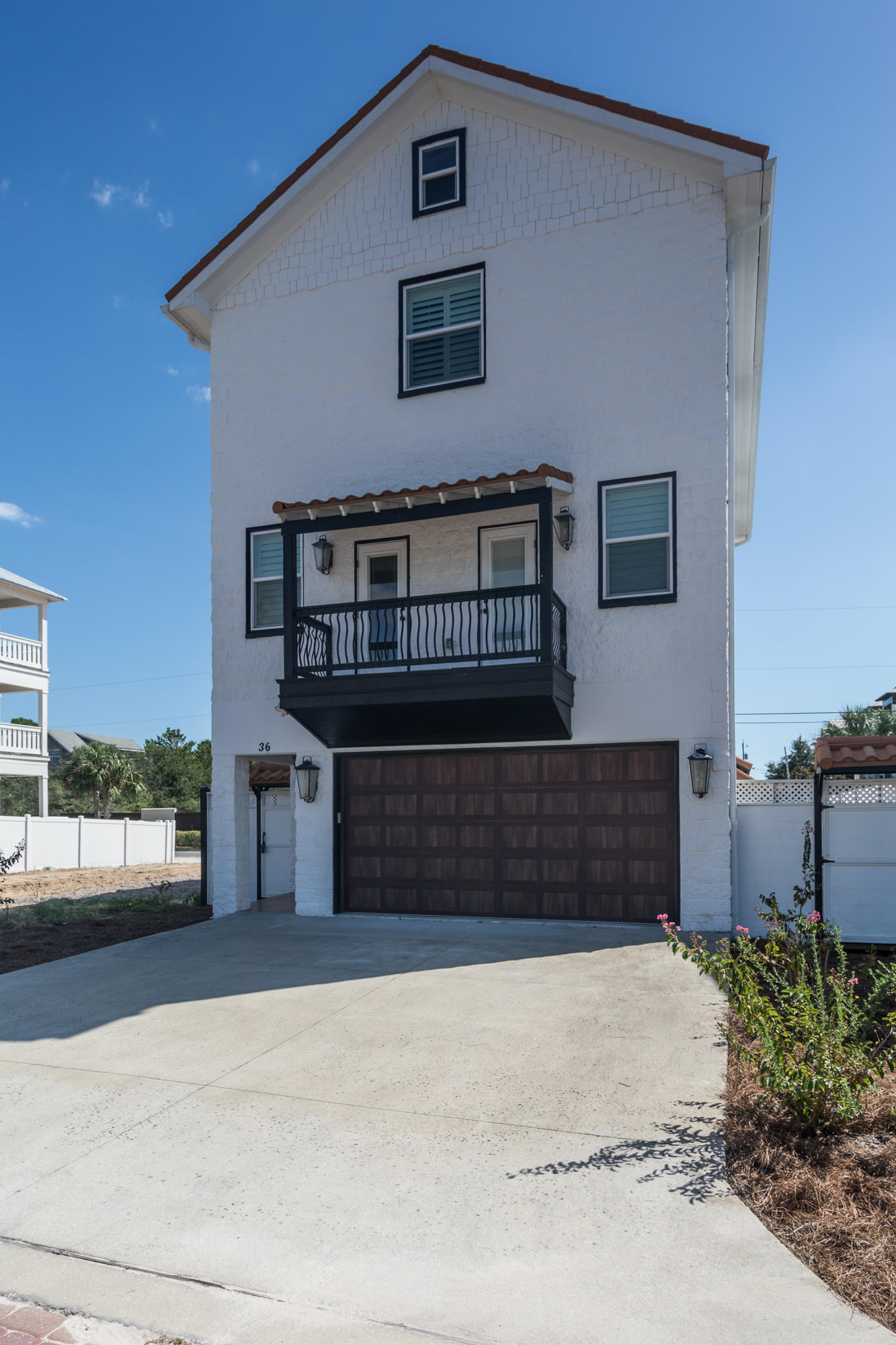 Inlet Beach home just 250' from the beach. Designed by a European architect with concrete walls, metal roof, elevator, endless pool/spa, pizza oven, tankless water heater, gas fireplace, marble counters, fenced yard, plantation shutters, double car garage with lots of storage. Attic storage area has been made into a workshop with plywood floors, shelving and natural light from two windows. Stainless kitchen appliances and a gas stove. One of the sitting areas could be a 5th bedroom. ( It also has a closet) This home has been a second home and has not been a rental but could be used as one like others on the street. Being sold furnished as seen (excluding the master bedroom mattress) Call for your private showing today!