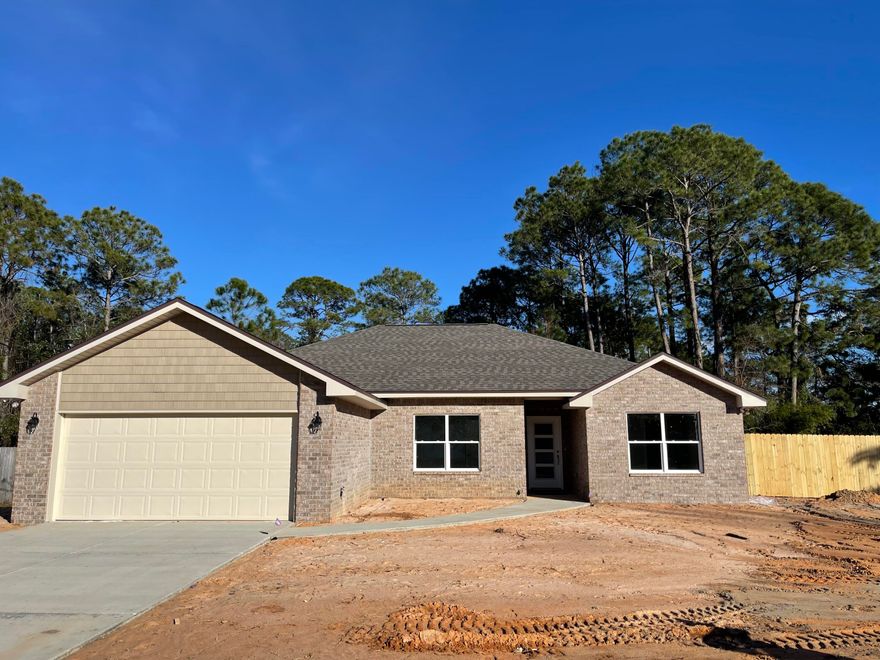 NEW ALL BRICK HOME ON LG QUIET LOT. GREAT LOCATION NEAR HURLBURT AFB & BEACHES. 
KITCHEN: Large sit up bar, Granite counters, Gray shaker style cabinets w/soft close drawers, Bronze fixtures, Stainless appliances. Spacious pantry. 
MASTER BATH: Granite counters, dual vanities, Lg custom tiled shower w/seamless glass door, W/I closet. MASTER: Ceiling fan, tray ceilings. 
PLUS: PREMIUM Vinyl wood plank floors. 12x24 tile in baths. Office w/LVP flooring, 3 Additional Bedrooms carpet. Covered back porch, Ceiling fans w/light, Hurricane Fabric protection, Pull down attic, french doors w/built-in blinds, Architectural shingles, Separate Laundry w/cabinets, Crown molding, Flat textured ceilings, Low-E windows, Sprinkler system. Privacy fenced. Builder Warranty.
This will go fast...call today!