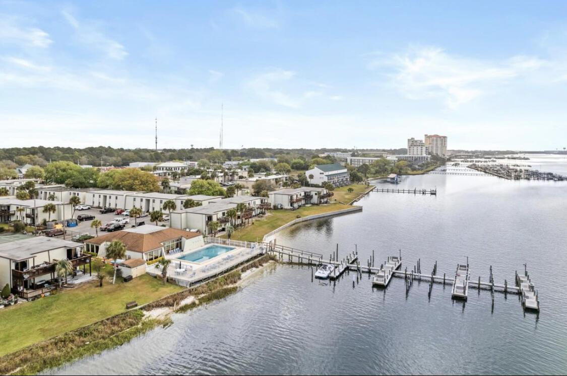 Welcome to your waterfront oasis! This fully updated two-bedroom, two-bath condo community nestled along the serene Santa Rosa Sound in Fort Walton Beach offers the ultimate coastal living experience. With all supplies just a couple of years old, including a brand new dishwasher, and fresh paint throughout, this condo exudes modern charm. The AC was replaced in 2020 and the water heater in 2016, ensuring comfort and efficiency. Every room boasts new furniture, making it turnkey and rental-ready for long-term tenants or your primary residence. Enjoy fantastic amenities such as a spacious lounging area right on the waterway, a refreshing pool, tennis court, and clubhouse with a full kitchen. Additional perks include boat slips and kayak racks for rent, a boat launch, and HOA fees covering