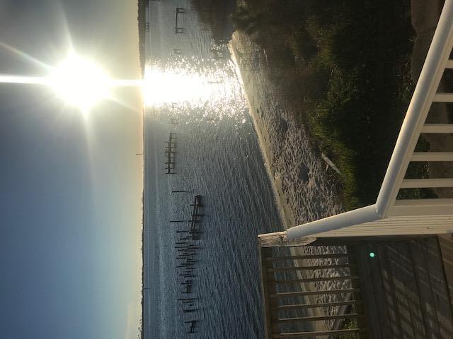 Great opportunity to enjoy the beautiful waterfront location. Beautiful waterfront condo only 1 mile from Hurlburt Field. Renovated ground floor condo has new hard wood floors, several new appliances, large bedrooms, open floorplan kitchen and living room. Two large French doors display the stunning view over the Sound and community pool just off the private patio. Complex also has a small private beach just off the pool area. Don't come see this unit unless you are ready to move in, because you will fall in love and never want to leave.