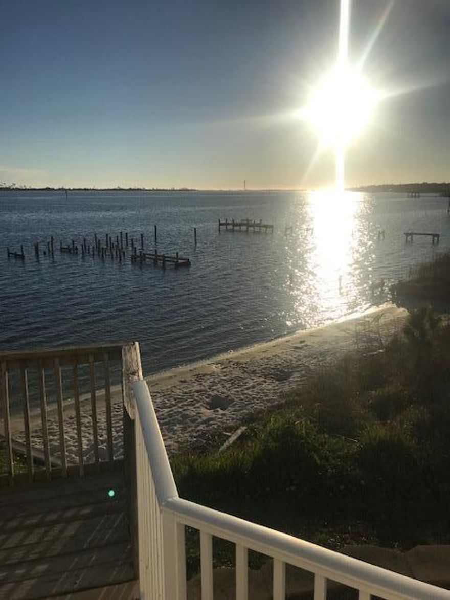 Great opportunity to enjoy the beautiful waterfront location. Beautiful waterfront condo only 1 mile from Hurlburt Field. Renovated ground floor condo has new hard wood floors, several new appliances, large bedrooms, open floorplan kitchen and living room. Two large French doors display the stunning view over the Sound and community pool just off the private patio. Complex also has a small private beach just off the pool area. Don't come see this unit unless you are ready to move in, because you will fall in love and never want to leave.