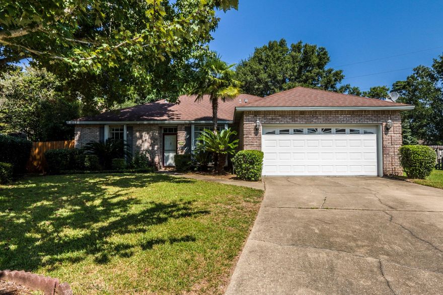 UPDATED GEM puts the BEST OF BLUEWATER BAY within arm's reach at an EXCEPTIONAL VALUE! Explore the property inside and out with the amazing 3D SHOWCASE available in PHOTOS. Situated on a spacious, fully-fenced 1/4 acre lot at the back of an idyllic cul-de-sac, this brick home features an open layout with NEW 10ml Hand-scraped Country Oak laminate flooring, fresh interior paint in a cool, modern palette, stately wainscoting in formal dining area, updated hardware in kitchen and bathrooms, updated lighting in dining and foyer, soaring vaulted ceilings with skylights as well as a heated and cooled Florida room. Large fenced backyard is perfect for entertaining, pets, and play; PLUS store and access RV, boat, and other toys through double gates located directly on Range Road! School age...