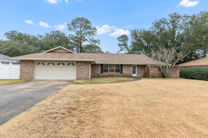 Large home on the Golf Course in Lake Lorraine Estates. This split floor plan has three spacious bedrooms and two bathrooms.  Three living areas allow for limitless entertainment possibilities.  You are greeted by a large formal living area with an open dining room as you enter the home.   A separate family room with a gas fireplace is open to the kitchen.  Finally a large heated and cooled Florida room overlooks the Golf Course.  The primary suite opens out to the lush backyard.  The primary bathroom opens out to a private bricked in zen garden. New roof in 2023.  New tankless water heater in 2022.  Close to Eglin and Hurlburt AFB, shopping and beautiful sand beaches.