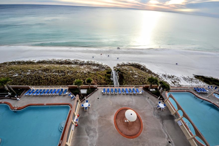 Sunrise Beach 11th Floor, 2 Bedroom, 2 Bath With Bunk Room. This Nicely Furnished Beach Front Unit has the Most Popular 2 Bedroom lay-out at Sunrise. Upgrades & Features include Tile throughout, Large Kitchen with Breakfast Bar, Granite Countertops, Gulf Facing Master Bedroom, Huge Master Bath with Double Vanity, Separate Bunk Room, Extra Large Balcony, Full Sized Laundry Room And a Deeded Exterior Storage Unit. Located directly on the Gulf of Mexico, Sunrise Beach Resort highlights an elevated gulf-front deck with two tropical pools (one seasonally heated), relaxing spas, children's water play area, gulf-front exercise room, meeting room and convenient covered parking under the building. The Resort is located just minutes from Pier Park and Frank Brown Recreation Center. Call Your Agent today to Schedule a viewing of this Fabulous Property. All Ages, Measurements and Room Sizes are Approximate. Please Verify if Important.