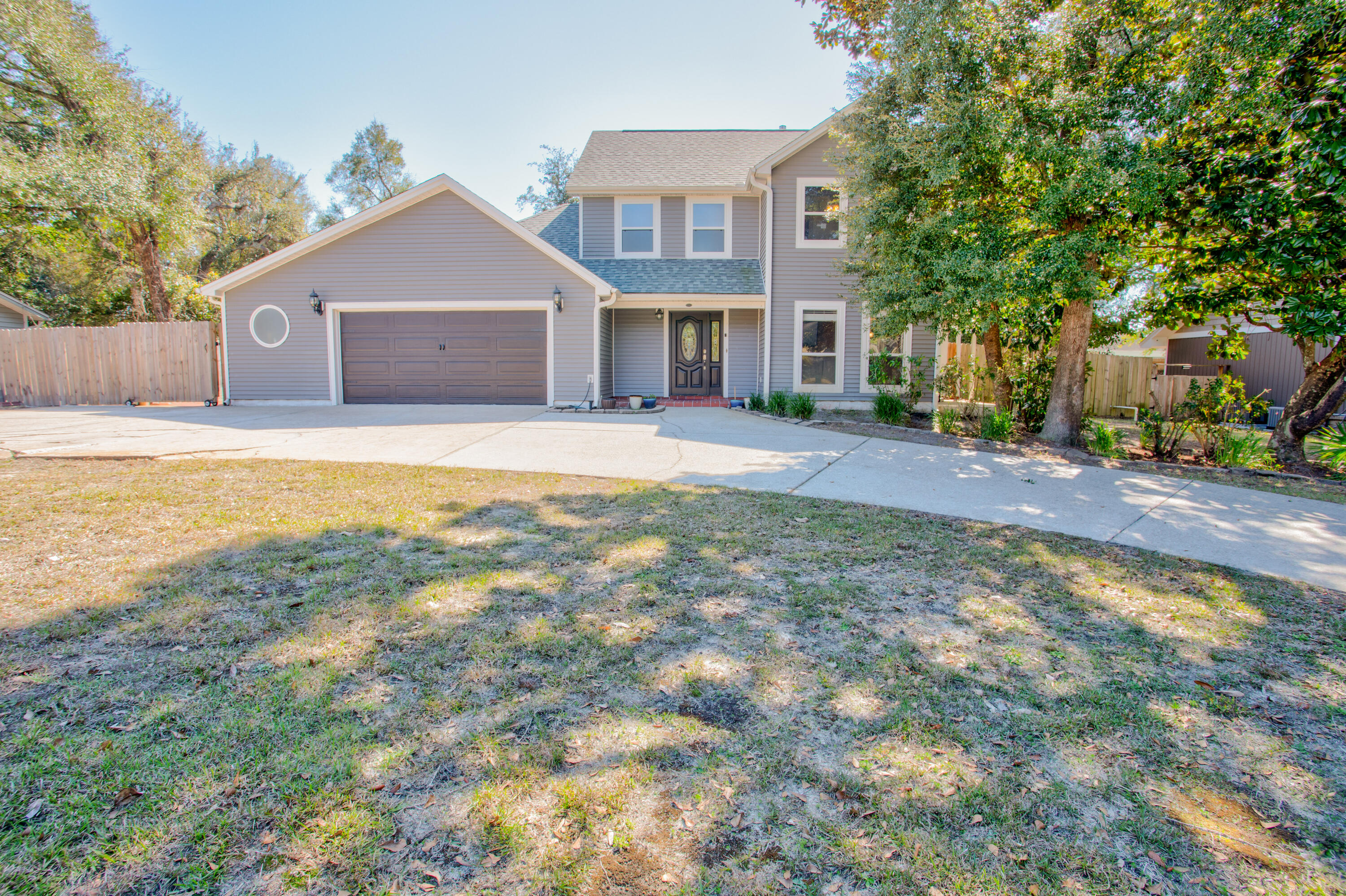 ** VA ASSUMABLE INTEREST RATE OF 2.5% ** Welcome to this stunning single-family home in the heart of Niceville, Florida! This beautifully maintained 3-bedroom, 2-bathroom property offers the perfect combination of comfort, convenience, and sustainable living.As you enter the home, you'll be greeted by a spacious and open floor plan that seamlessly connects the living, dining, and kitchen areas. Featuring TWO living room areas, this home offers plenty of space for family gatherings, while the modern kitchen boasts ample cabinetry, a new dishwasher, and a breakfast bar.The master suite is a true retreat, featuring a spacious layout and an en-suite bathroom with a large walk-in slate floor shower. Two additional well-sized bedrooms provide plenty of space for family, guests, or a home office. Step outside to your private oasis! The screened-in pool is the perfect place to cool off on hot summer days, while the covered patio offers a relaxing spot to unwind in the evenings.
In addition to the pool, this home is equipped with paid-off solar panels, ensuring energy savings and a smaller carbon footprint. Plus, there's ample space for your RV or boat, making it easy to enjoy all that the Florida lifestyle has to offer.
Situated in a tranquil neighborhood, this home is also conveniently located to top-rated schools, parks, shopping, dining, and more. Don't miss out on this exceptional opportunity to own a home that blends style, functionality, and sustainability!
Roof - 2021, HVAC - 2010 & 2021 (2 separate units for upstairs/downstairs), HWH - 2006, Pool pump - 2021, Dishwasher - 2025