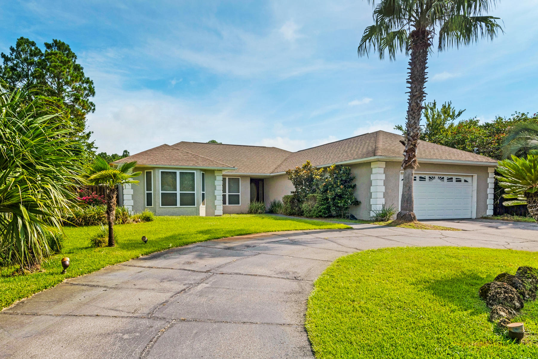 Stunning home centrally located in the heart of Panama City. This 3 bedroom 2 bath, 2500 sf, open floor plan home has a backyard oasis that includes an in-ground pool, pool house with summer kitchen and full bath, hot tub, gazebo, wood deck, and privacy-fenced yard. The large master bedroom has an office area/sitting area as well as a large master bath with walk-in closet, separate tiled shower, garden tub and vanity. This home has an enclosed tile sunroom area that overlooks the amazing backyard and adds entertaining space. There's beautiful wood flooring throughout, crown molding in the bedrooms, a nice size kitchen that features stainless steel appliances, built in wine cooler, kitchen island with seating and plenty of counter and cabinet space. The large guest bedrooms have bay windows