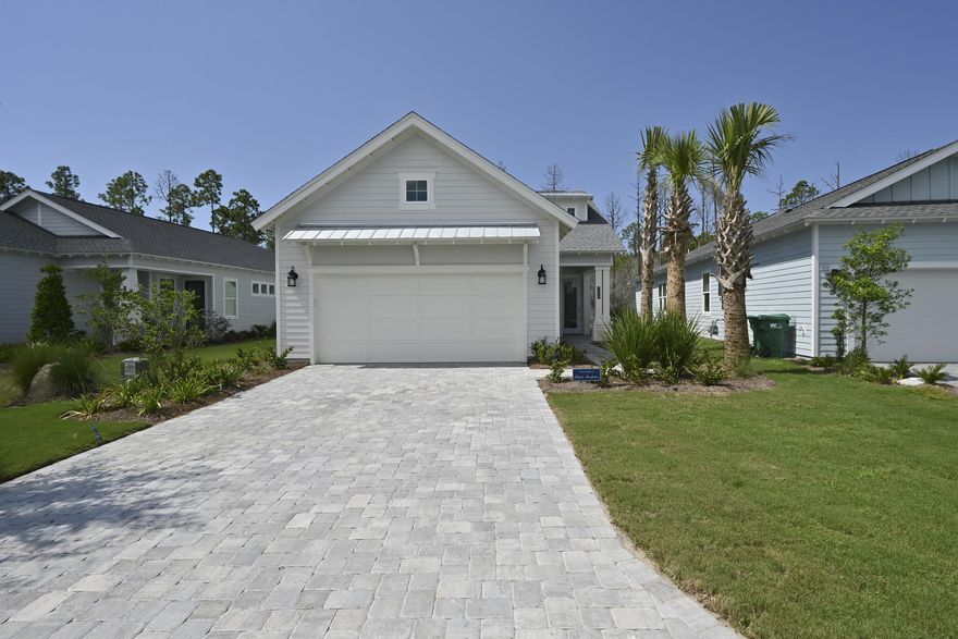 This brand new, fully furnished home in Naturewalk at Watersound Origins is move-in ready! The single-story 2-bed, 2-bath floor plan boasts a convenient den and an oversized 2-car garage. Interior features include laminate flooring throughout with tile in the laundry and baths, granite countertops, and more. The gas fireplace in the open concept living area is a natural gathering place, and the spacious covered back porch lends itself to al fresco dining & entertaining. The primary bedroom boasts two walk-in closets plus a luxurious ensuite bath with dual vanities and a tiled walk-in shower. Residents enjoy access to world-class amenities, including a resort style community pool, fitness center, world-renowned par-3 golf course, sports courts, nature trails, and dock access at Lake Powell.