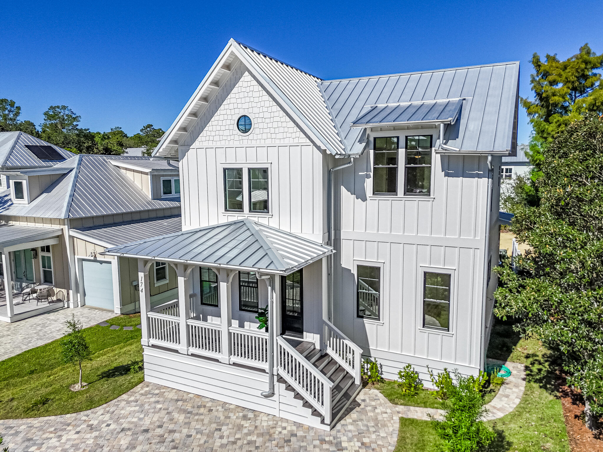 Welcome to 174 Grande Pointe Circle, a brand-new, meticulously crafted coastal retreat in the heart of Inlet Beach. This stunning 4-bedroom, 3.5-bathroom home offers 2,600 square feet of heated and cooled living space, complemented by 300 square feet of covered outdoor living. Every detail exudes luxury and craftsmanship. The exterior showcases a Castle Rock stone driveway, Trex decking, stained porch ceilings, a premium metal roof, outdoor shower, and impact-rated windows and doors, blending beauty with resilience.Inside, the thoughtful design continues with soaring 10-foot ceilings, shiplap accents, and high-end LVP flooring that seamlessly blend charm with modern durability. The chef's kitchen boasts designer finishes, gas stove, a farmhouse sink, and custom cabinetry. Adjacent, the spacious laundry room is equipped with a utility sink and ample storage. The first-floor owner's suite provides a spa-like retreat, showcasing floating cabinets, a soaking tub, and a walk-in shower with dual shower heads.

Upstairs, the carefully planned layout includes three additional bedrooms, a flexible space, a Jack-and-Jill bathroom with dual vanities, and another walk-in shower. Built to last, this home features hurricane-rated construction with 2x6 framing and hurricane ties throughout, ensuring both security and peace of mind.

Located next to Camp Helen State Park and just moments from Scenic Highway 30A, this home offers effortless access to pristine beaches, shops, and restaurants, all accessible via a new pedestrian underpass. As part of the Grande Pointe community, residents enjoy exclusive amenities, including a pool, fitness center, and kayak launch on Powell Lake.

With its prime location, exquisite upgrades, and timeless design, this home is a true gem in Grande Pointe. Schedule your private tour today!