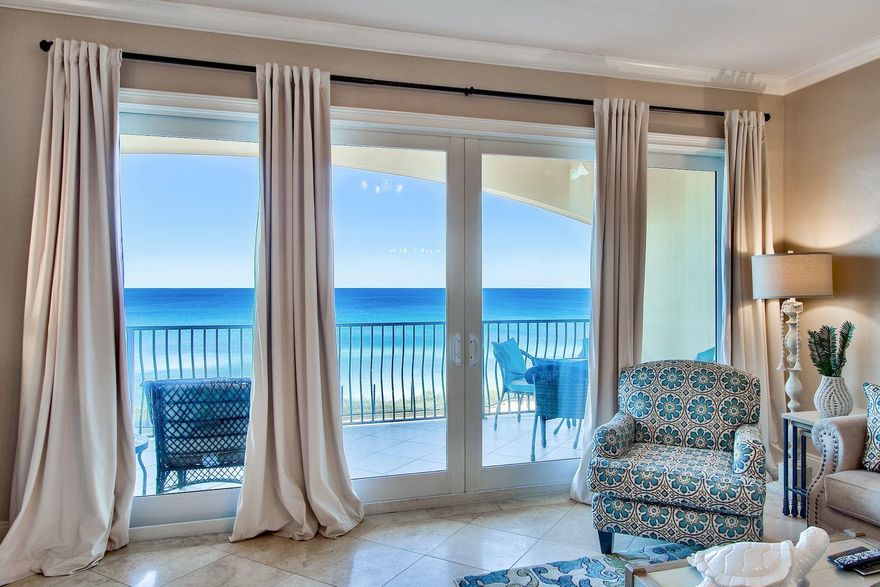 Ideally situated in the gated gulf-front community of Adagio, this recently-remodeled vacation condo is a serene beach retreat with luxurious finishes. Offering 2,200 square feet of living space, open-concept living areas feel airy and inviting. Exquisite views of the Gulf of Mexico can be enjoyed throughout the unit, which also offers an expansive balcony for outdoor dining and entertaining. Notable updates include new flooring, designer decor, and new counters. An inspiring setting for preparing meals, the fully-equipped kitchen features high-end Viking appliances, quartz countertops, ample cabinetry, and a large breakfast bar. The master suite enjoys private balcony access and direct gulf views, while the master bath provides a luxurious place to rinse off sugar-white sand with a