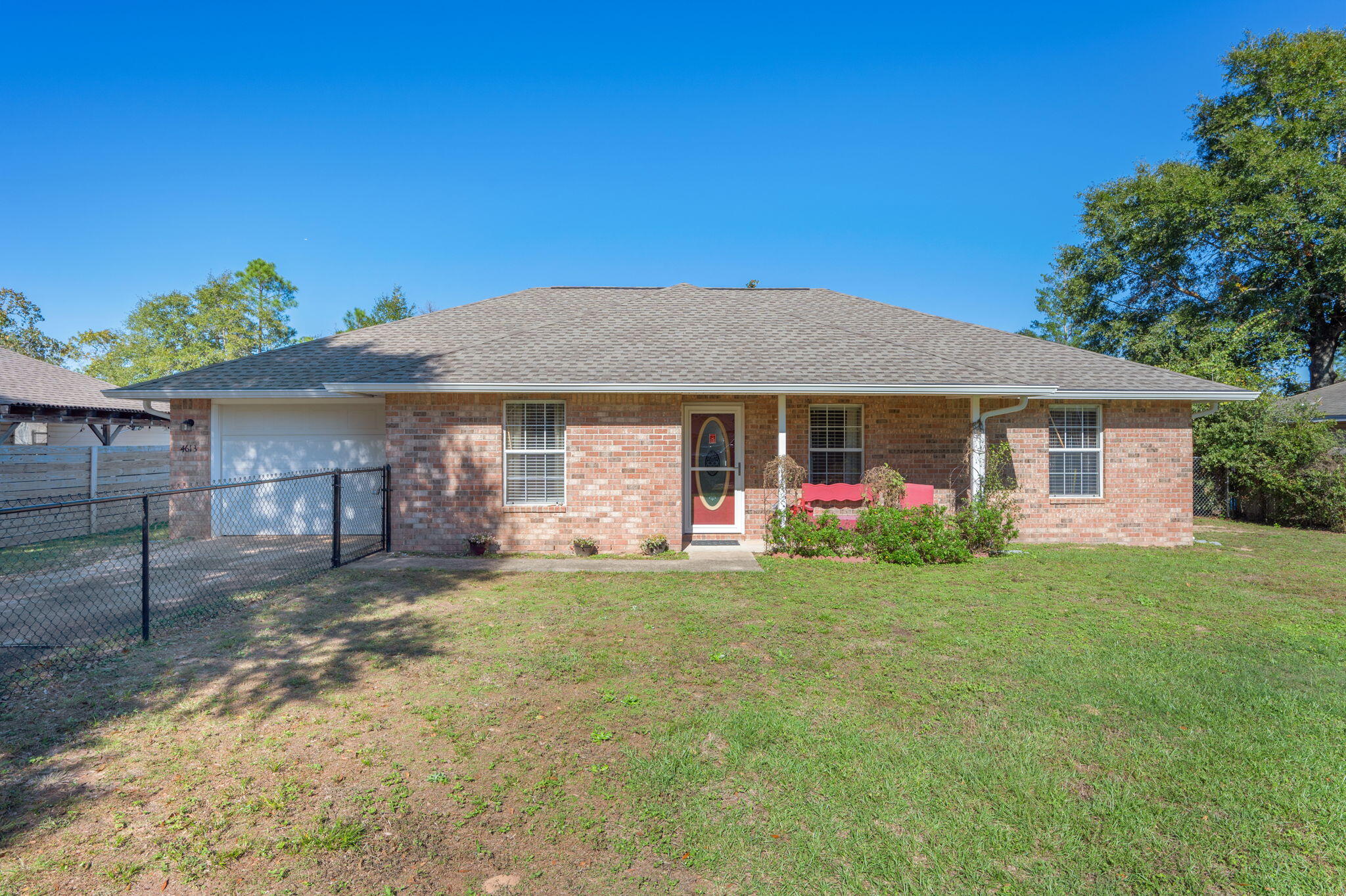 Beautifully maintained home in a quiet country setting, *mins to I-10 & 285 for easy access to Duke Field/EglinAFB/7SFG* This adorable home packs an amazing value and feels much larger than 1500sqft. LVP flooring throughout nicely accents the split bedroom floorplan and opens up to a beautifully remodeled kitchen--with ample cabinets, large pantry area, and a massive laundry/mudroom area. Screened in back patio overlooks a great fenced in backyard area with beautiful landscaping. This property also offers the unique feature of a fenced in front yard, so you have dual options for outdoor enjoyment!  Roof replaced 2022 andSeller to provide home warranty for the next homeowner, for peace of mind.